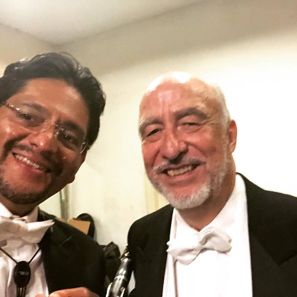 Jean-Pierre and Javier wearing performance tuxedos in a candid moment before a performance.